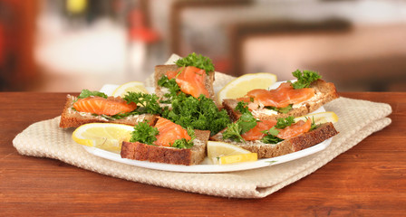 Salmon sandwich on plate,on bright background