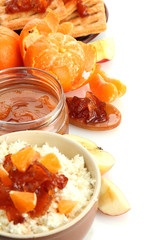 cottage cheese in bowl with homemade tangerine jam, isolated