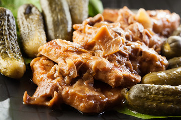 Pork loin with mushroom sauce. Dark light