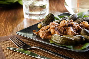 Pork loin with mushroom sauce. Dark light