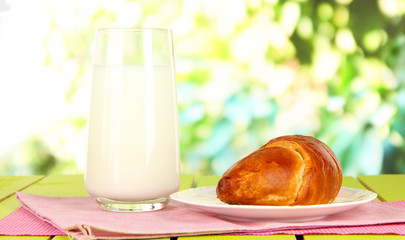 Bread roll and glass of milk