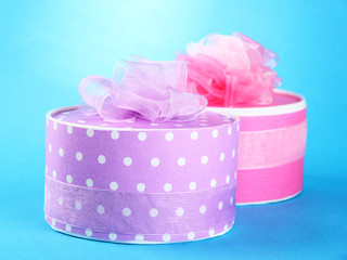 Bright gifts with bows on blue background