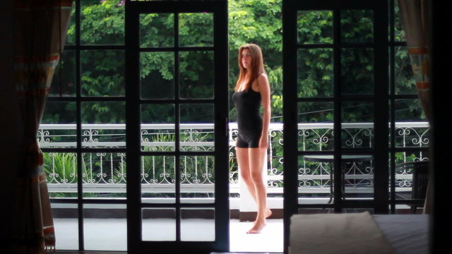 woman on the veranda of the tropical house