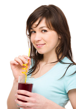 Young Woman Is Drinking Cherry Juice