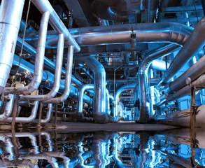 Foto op Plexiglas Industrieel gebouw Industrial zone, Steel pipelines and cables in blue tones