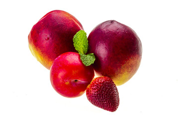 Ripe bright peaches, plum, strawberry and mint