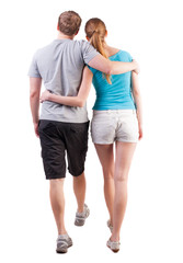 Back view of going young couple