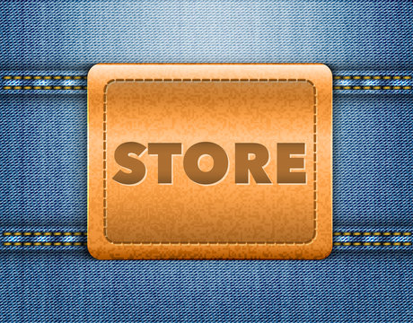 Store word on brown leather label on blue jeans background