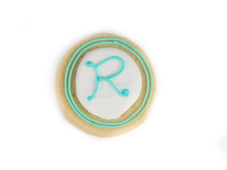 round baked biscuit with a letter