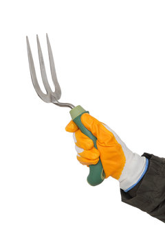 Gardening fork in human hand with protective gloves