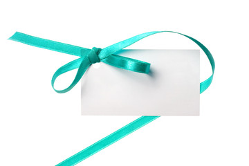 Blank gift tag tied with a bow of green satin ribbon.