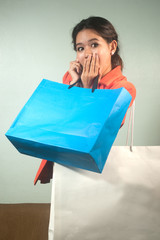 Busy young Asian business  woman with shopping bags .