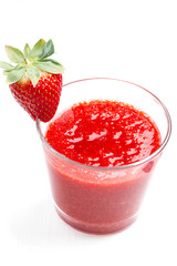 Fresh made strawberry jam in glass with fresh strawberry on whit