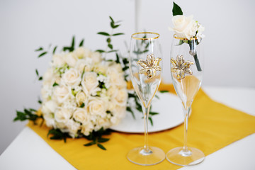 wedding glasses and groom boutonniere