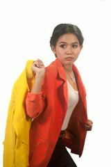 Pretty Asian business woman holding yellow suit .