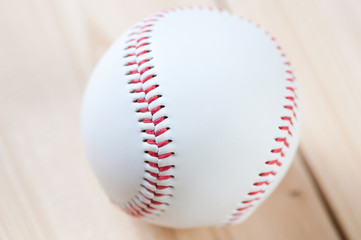 Baseball ball on wooden boards, studio shot