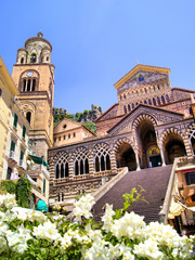 Ornate Amalfi Cathedral with flowers, Italy