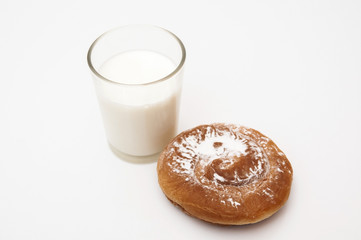 glass of milk with sugar ensaimada