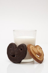 glass of milk with heart shaped cookies