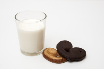 glass of milk with heart shaped cookies