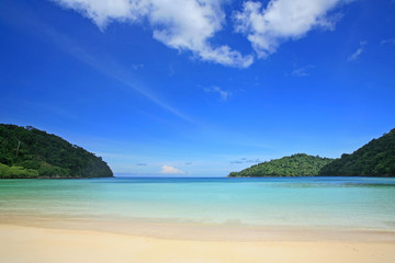 Fototapeta na wymiar Tropical beach against blue sky in Surin Islands