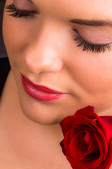 Beautiful female with romantic rose - obrazy, fototapety, plakaty