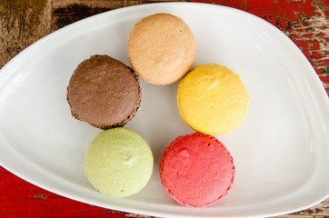 Colorful macaroons on the dish
