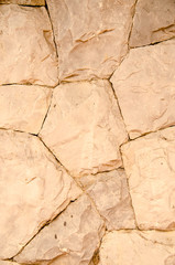 Detailed stone wall background in beige tones