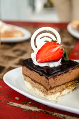 Piece of chocolate cake with  fresh strawberry