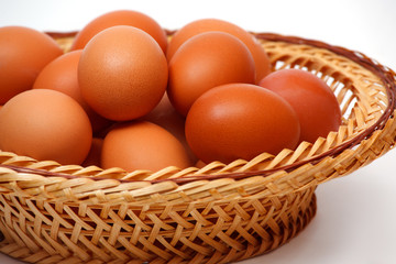 Colored eggs in basket