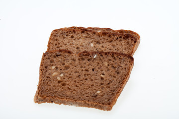 Slices of dark bread isolated over white