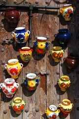 Ceramic flower pots on wooden door, Spain © Arena Photo UK