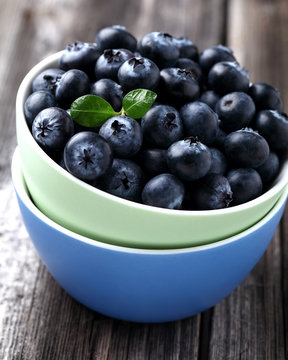 Fresh ripe blueberries in the colored plates