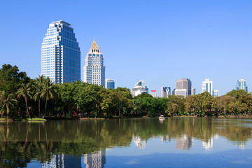 Business district cityscape from a park with blue sky