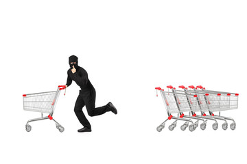 Full length portrait of a robber stealing an empty pushcart