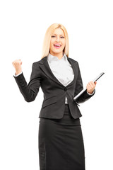 Young professional woman holding a clipboard and  gesturing happ