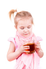 Sick little girl with chickenpox drinking tea with lemon