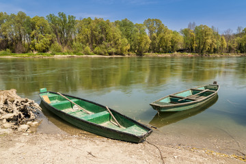 Two green boats in the river