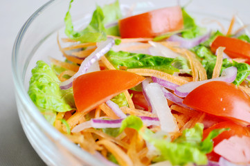 fresh salad in glass bowl