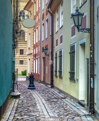 Narrow mrdieval street in old Riga, Latvia, Europe
