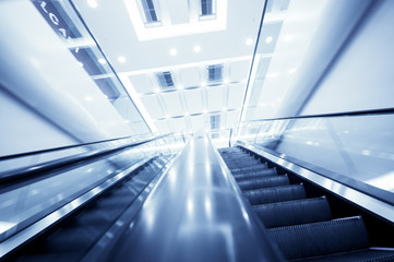 Escalator in modern office building,motion blur