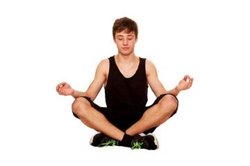 Teenager boy meditating and relaxing after a workout.