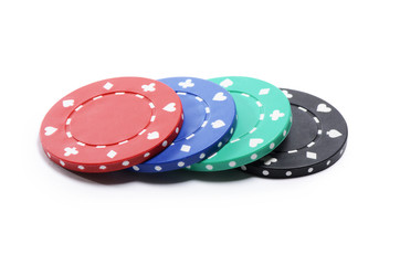 Four casino chips isolated on white
