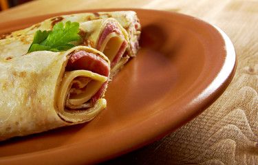 rolled pancakes stuffed ham and cheese.