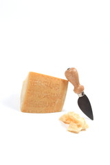 Parmesan cheese with knife, isolated on white
