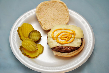 Burger with Cheese, Mustard, and Pickle Slices