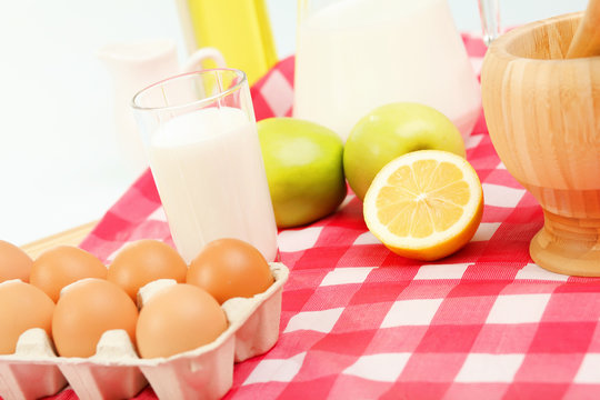 Milk in a glass jar and eggs