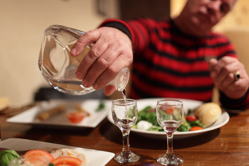 Man buttles vodka in a bar