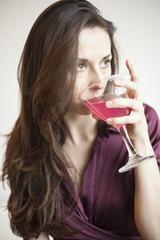 Beautiful Young Woman Holding a Pink Martini