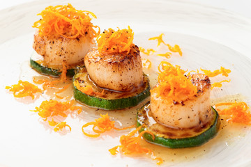 Fried sea scallops with orange zest